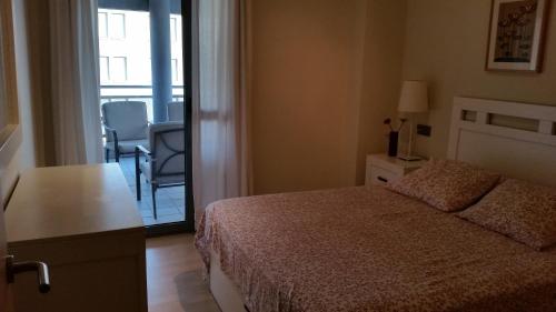 En eller flere senge i et værelse på Apartamento Moderno, Bonito y Acogedor