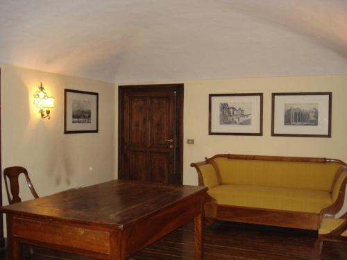a living room with a couch and a table at Santuario di Oropa in Biella