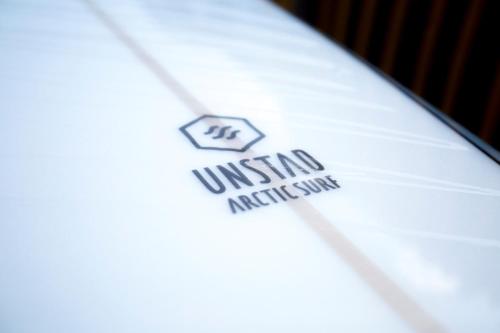 a close up of a white shirt with a united insignia on it at Unstad Arctic Resort in Unstad