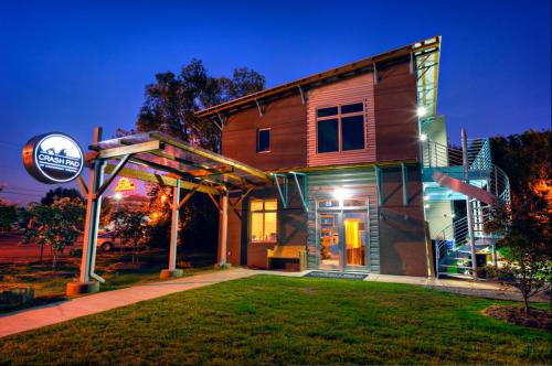 a house with a sign in front of it at night at The Crash Pad: An Uncommon Hostel in Chattanooga