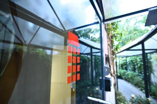a window of a building with a red sign on it at Art-Hotel Robert Mayer in Frankfurt/Main