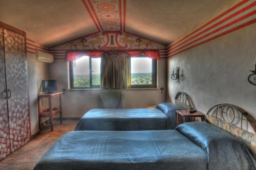 Letto o letti in una camera di Guest House Qui Dormì L'Etrusco