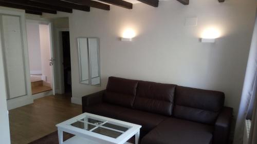 a living room with a couch and a table at Hotel Resort Cueva del Fraile in Cuenca