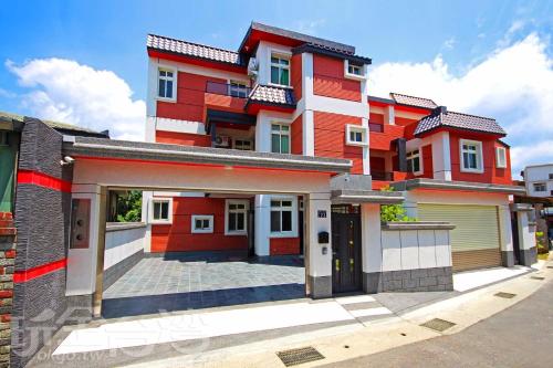 a row of houses with red and white at Shi Qing Homestay in Puli