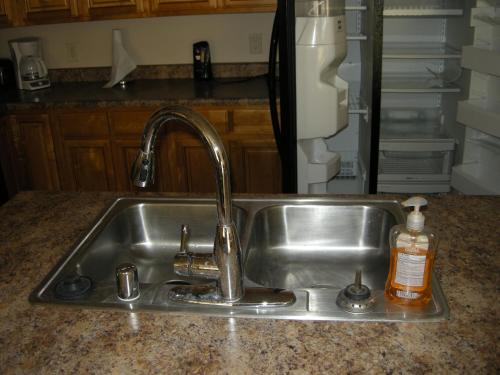 a kitchen sink with a faucet in a kitchen at Nevada Mesquite Vacation Rentals in Mesquite