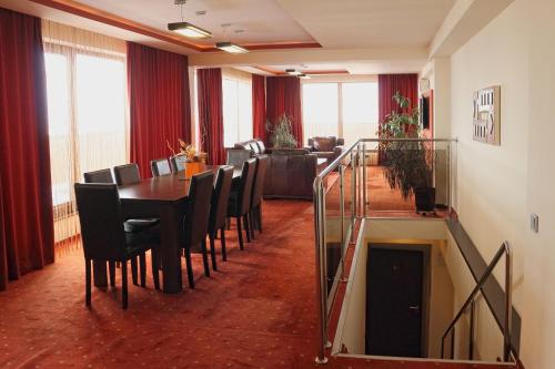 a dining room with a table and chairs at Hotel Premier in Sibiu
