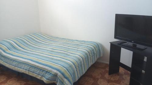 Katil atau katil-katil dalam bilik di Hotel Rozal Spa Iquique