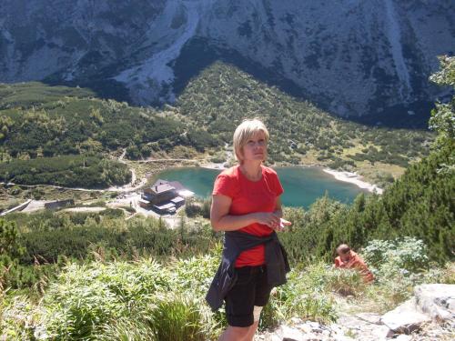 a woman standing on the side of a mountain at Penzión Soňa in Ždiar