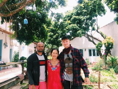 a group of three people posing for a picture at Vietnam Phuot Real Home in Kon Tum