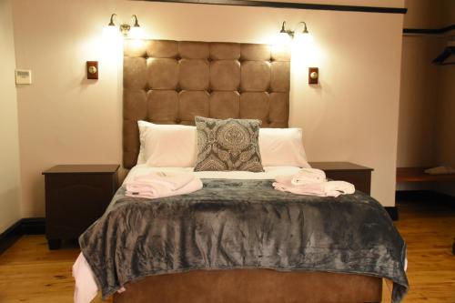 Ένα ή περισσότερα κρεβάτια σε δωμάτιο στο New Rush Guest House