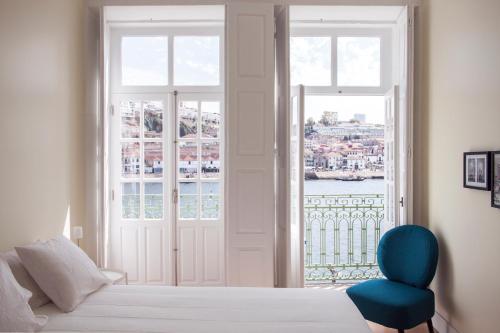 En eller flere senger på et rom på Panorama Apartments Ribeira Porto
