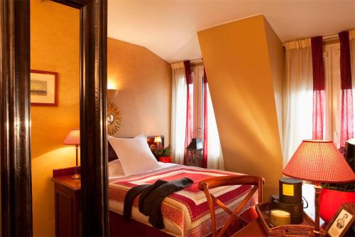 Кровать или кровати в номере Hotel Britannique