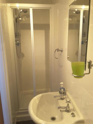 a bathroom with a sink and a shower at Maggie's in Inveraray