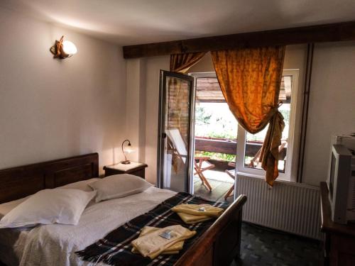 Katil atau katil-katil dalam bilik di Pensiunea Casa Noastra