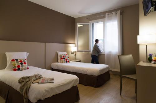 Postel nebo postele na pokoji v ubytování Logis Hôtel & Restaurant Le Pardaillan