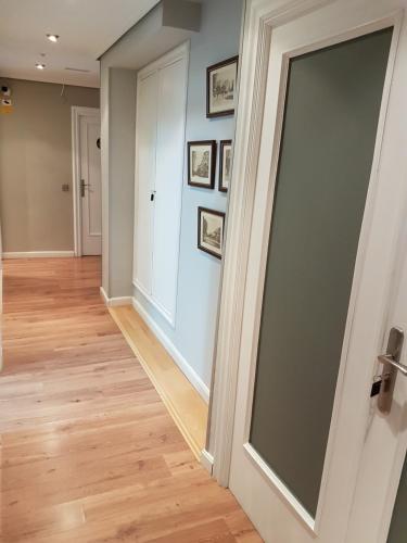 a hallway with a large sliding glass door at Pensión El Espolón in Logroño