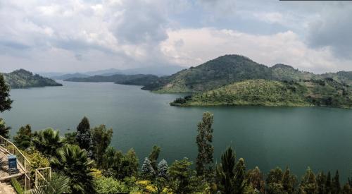 a view of a lake with mountains in the background at Pili Pili Boutique Hotel in Kigali