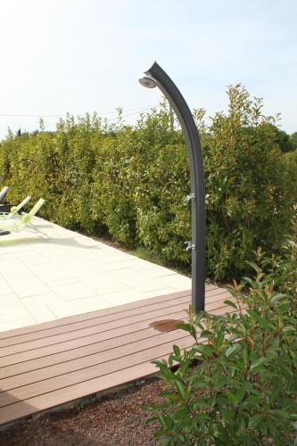 a street light sitting on a wooden deck at L'Ansolane in Fuveau