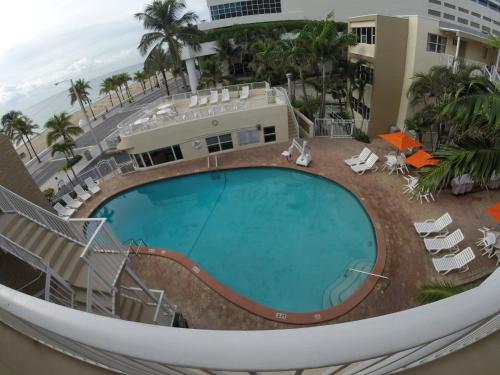 arial view of a swimming pool at a resort at Silver Seas Beach Resort in Fort Lauderdale