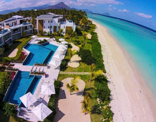 an aerial view of the resort and the beach at Cap Ouest Beachfront Luxury Penthouse & Apartment in Flic-en-Flac