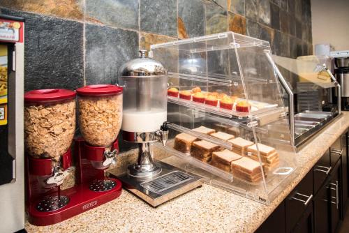 a kitchen counter with a blender and some pastries at Best Western PLUS Monterrey Airport in Monterrey