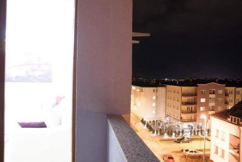 a view of a city at night from a building at Istocno Sarajevo 02 in Sarajevo