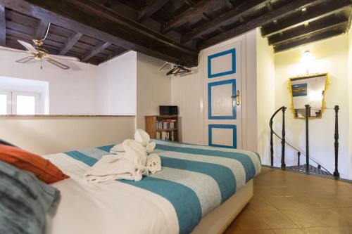 En eller flere senge i et værelse på Moroni Trastevere Cozy Apartment