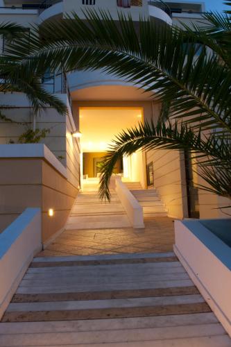 a stairway leading up to a building at night at Elizabeth Suites in Kato Daratso