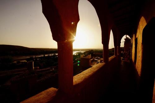 a view of the sunset from the balcony of a building at Dar Mouna in Aït Ben Haddou