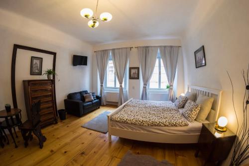 Postel nebo postele na pokoji v ubytování B&B Krumlov