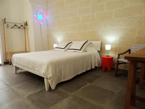 Postel nebo postele na pokoji v ubytování Le Luminarie B&B