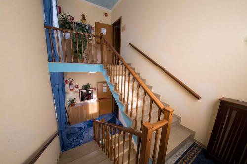a spiralling staircase in a house with at Hotel Vela Azzurra in Malcesine