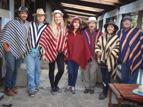 a group of people in hats posing for a picture at Hacienda EL SINCHE in Machachi