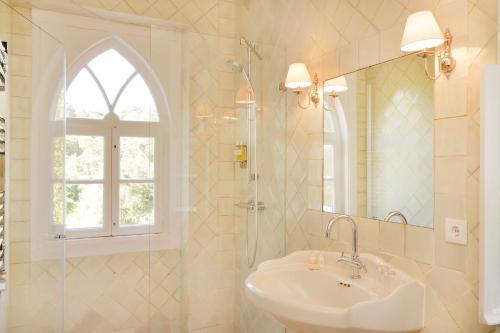 a bathroom with a sink and a shower and a mirror at Casa Holstein Quinta de Sao Sebastiao Sintra in Sintra