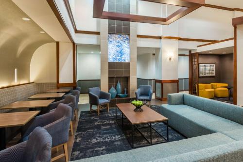a lobby of a hotel with couches and tables at Hyatt Place Atlanta Duluth Johns Creek in Johns Creek