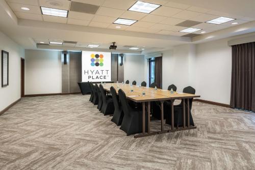a conference room with a long table and chairs at Hyatt Place Atlanta Duluth Johns Creek in Johns Creek