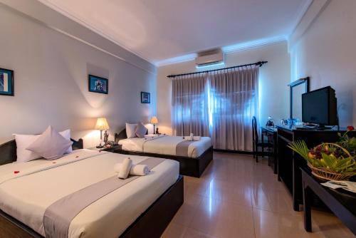 เตียงในห้องที่ JK Resident