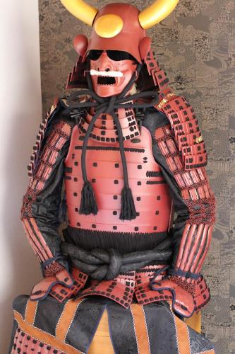 a statue of a man in a samurai costume at GUEST HOUSE E-NINE in Kyoto