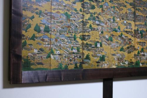 a painting hanging on a wall at GUEST HOUSE E-NINE in Kyoto