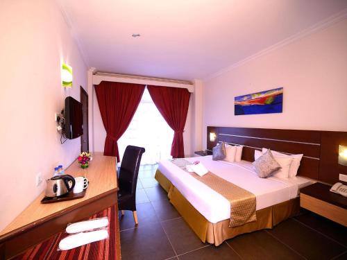 Кровать или кровати в номере Bella Vista Express Hotel