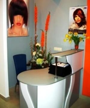 a office with a white desk with flowers on it at Hotel Complex Gayki in Zhytomyr