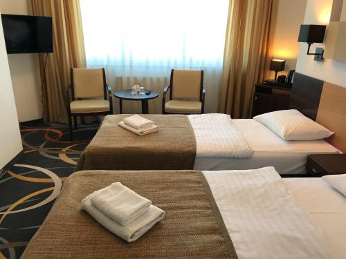 Ένα ή περισσότερα κρεβάτια σε δωμάτιο στο La Petite APARTMENTS & ROOMS