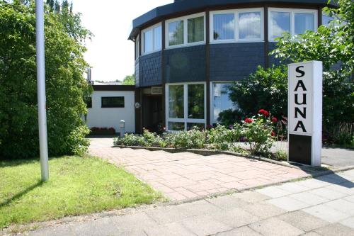a house with a sign that reads sustainability at Hotel Pfälzer Hof GmbH in Braunschweig