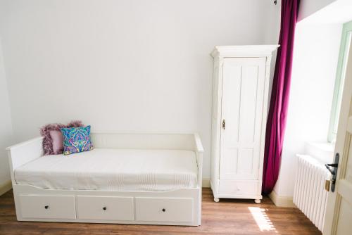 Un ou plusieurs lits dans un hébergement de l'établissement Maison BOGArT