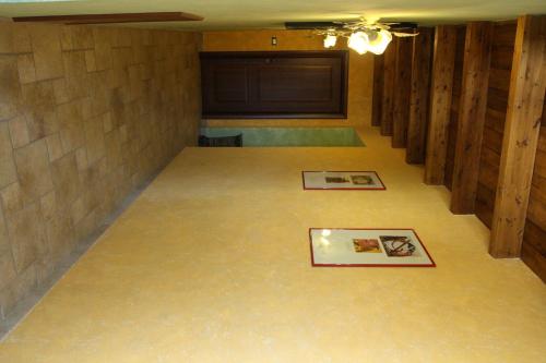 an empty room with two pictures on the floor at Il Vecchio Mulino in Brecciarola