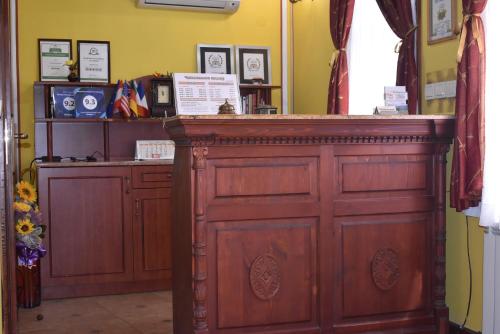 a room with a wooden door and a counter at Family Hotel at Renaissance Square in Plovdiv