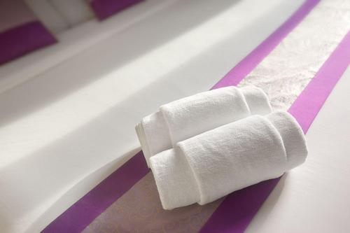 a roll of toilet paper sitting on a table at Shanti Boutique Hotel in Srithanu