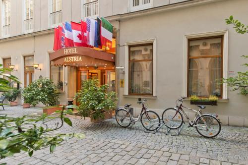 a row of bikes parked in front of a building at Hotel Austria - Wien in Vienna