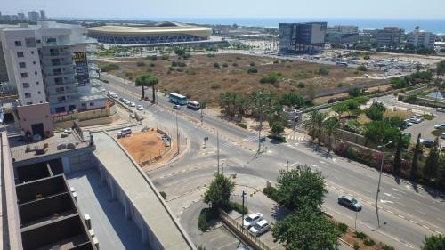 an aerial view of a street in a city at La Cappella Business Boutique Hotel in Haifa