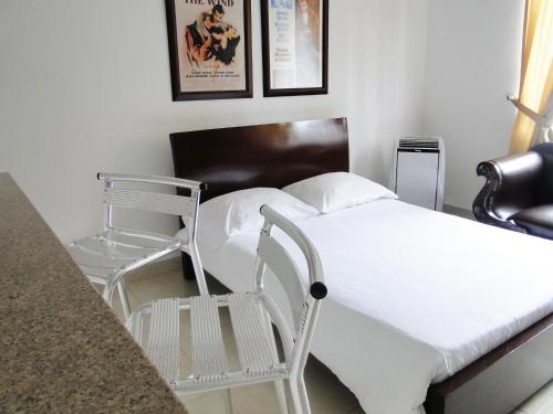 Cama o camas de una habitación en Arco Apartasuites